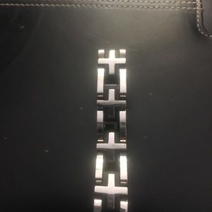 Thick cross  silver and black.
